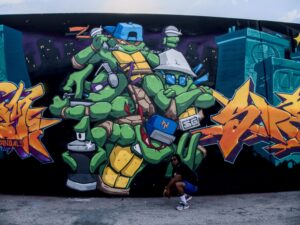 Clutch in front of TMNT mural